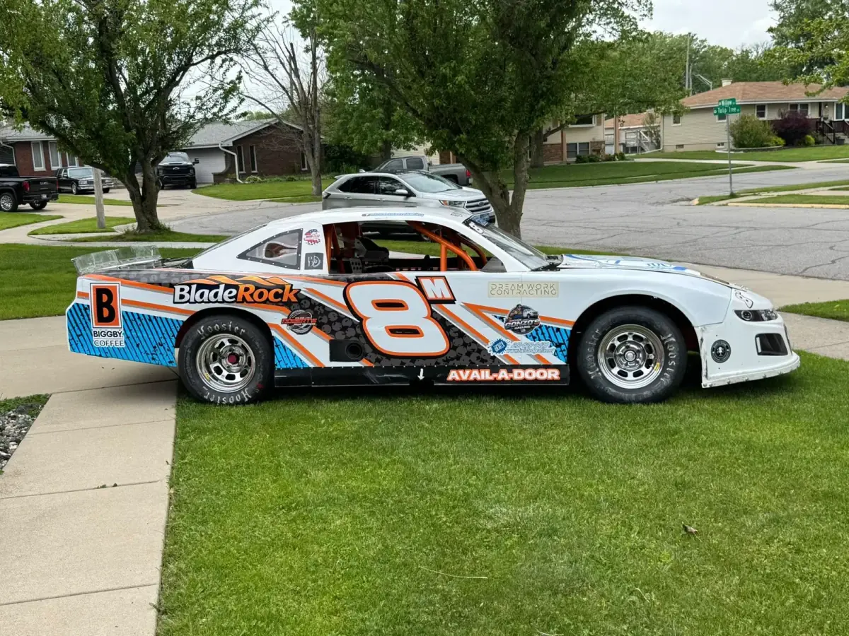 Michael Moore Racing's #8 stock car carrying the Speedy Gonzo's Hauling sponsor decal